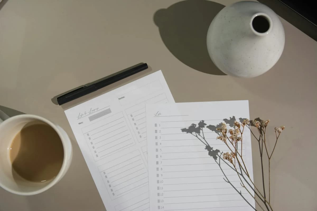 A printed checklist and pen on a desk